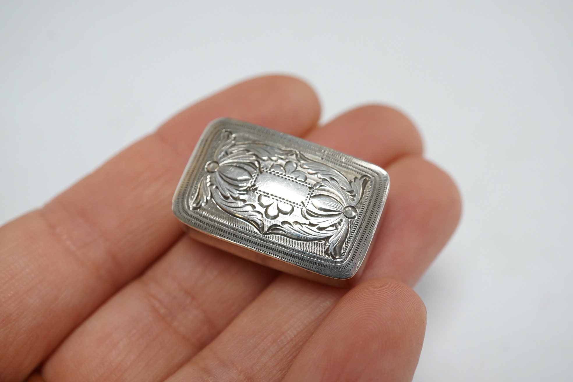 A George IV engraved silver rectangular vinaigrette, Joseph Wilmore, Birmingham, 1829, 26mm. Condition - fair to good